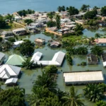 A coastal community in Ghana facing erosion and flooding risks, with climate adaptation and resilience measures underway.