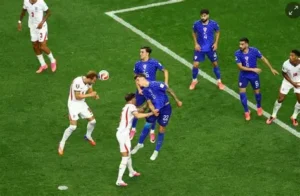 Harry Kane heads th ball into the net