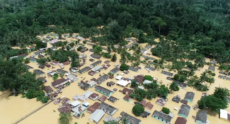 An aerial view showing widespread flooding across residential communities in Samreboi following the overflow of nearby rivers.