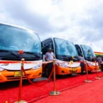 New Metro Mass buses lined up during a commissioning ceremony as Ghana expands its public transport fleet.