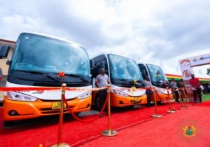 New Metro Mass buses lined up during a commissioning ceremony as Ghana expands its public transport fleet.