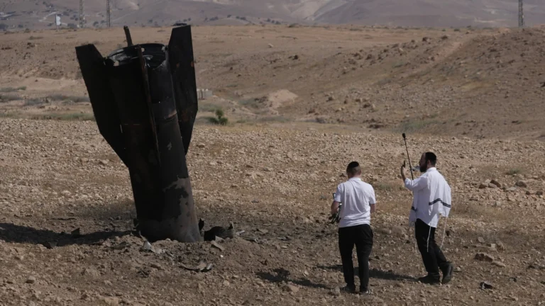 Missile debris embedded in the ground following recent military exchanges between Iran and Israel.