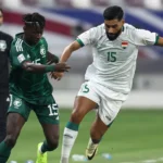 Saudi Arabia and Senegal players challenge for the ball during a World Cup warm-up match in Texas.