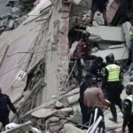 Emergency responders search a collapsed building following powerful earthquakes in Caracas, Venezuela.