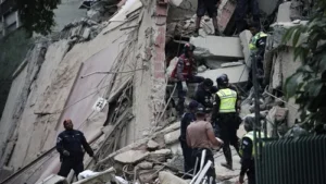 Emergency responders search a collapsed building following powerful earthquakes in Caracas, Venezuela.