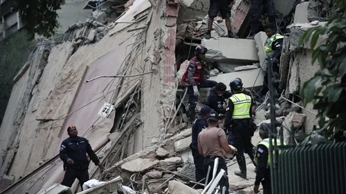 Emergency responders search a collapsed building following powerful earthquakes in Caracas, Venezuela.