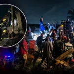 Emergency responders working at the scene of a building collapse in Adenta.