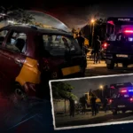 Police vehicle near a damaged taxi during a night-time investigation following a suspected taxi hijacking incident in La, Accra.