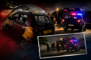 Police vehicle near a damaged taxi during a night-time investigation following a suspected taxi hijacking incident in La, Accra.