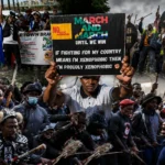 Protesters gather during a demonstration against illegal immigration policies in South Africa.