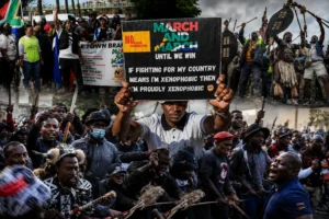 Protesters gather during a demonstration against illegal immigration policies in South Africa.