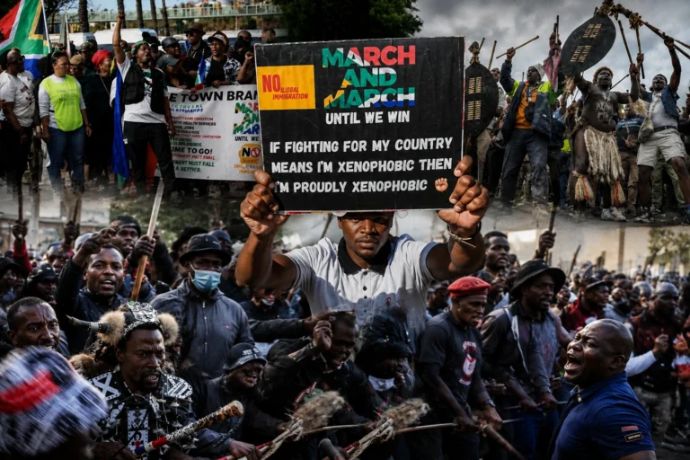 Protesters gather during a demonstration against illegal immigration policies in South Africa.