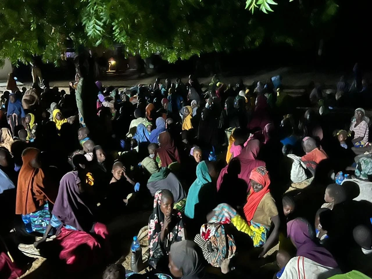 Freed Boko Haram captives gather overnight after a rescue operation in Borno State, northeastern Nigeria.