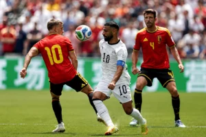 Egypt and Belgium players battle for possession during a World Cup match that ended in a draw.