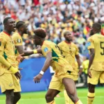 Ghana players defend against England during World Cup draw