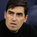 Andoni Iraola applauds supporters during a Premier League match.