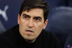 Andoni Iraola applauds supporters during a Premier League match.