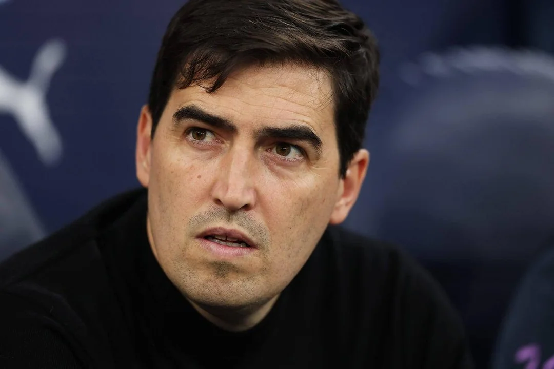 Andoni Iraola applauds supporters during a Premier League match.