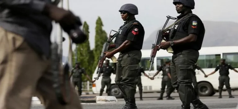 Nigerian police officers on patrol following security warnings over potential reprisals against South African interests.