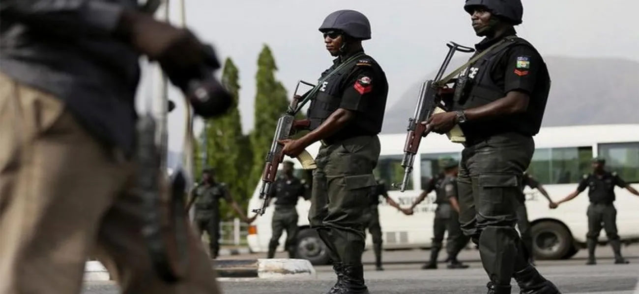 Nigerian police officers on patrol following security warnings over potential reprisals against South African interests.