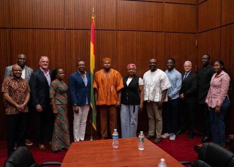 Officials, partners and stakeholders pose for a group photograph during a meeting related to the World Cup Fans Diary initiative.
