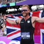 Josh Kerr celebrates after setting a new men's mile world record of 3:42.66 in London.