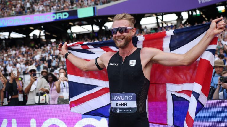 Josh Kerr celebrates after setting a new men's mile world record of 3:42.66 in London.