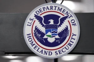 US Department of Homeland Security seal displayed during the announcement of new visa regulations affecting international students and foreign journalists.