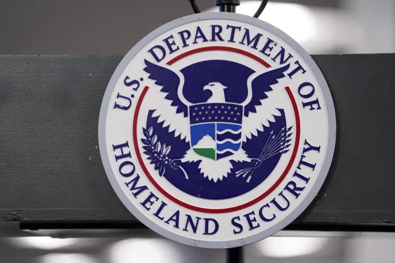 US Department of Homeland Security seal displayed during the announcement of new visa regulations affecting international students and foreign journalists.