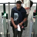 Airport CCTV image of the Bedford triple murder suspect before his departure from Heathrow Airport.