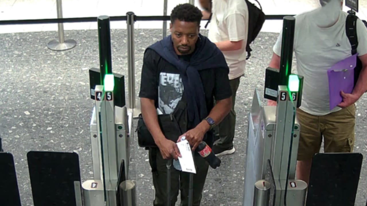 Airport CCTV image of the Bedford triple murder suspect before his departure from Heathrow Airport.