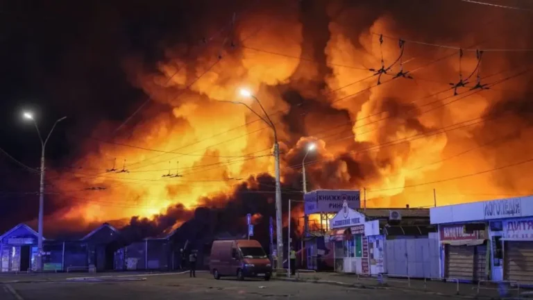 Fire and smoke rise from a Kyiv book market following a Russian missile strike.