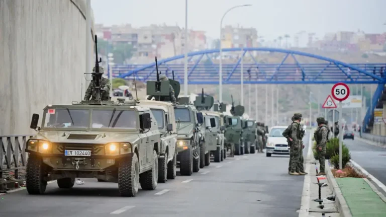 Spanish soldiers and police responding to migrant arrivals in Ceuta on Spain's North African border.