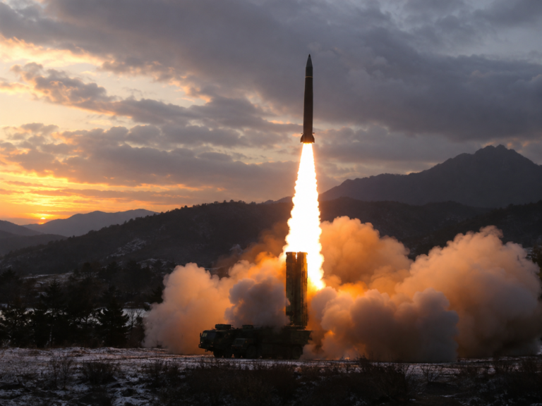 Dawn Missile Launch Over Misty Mountains